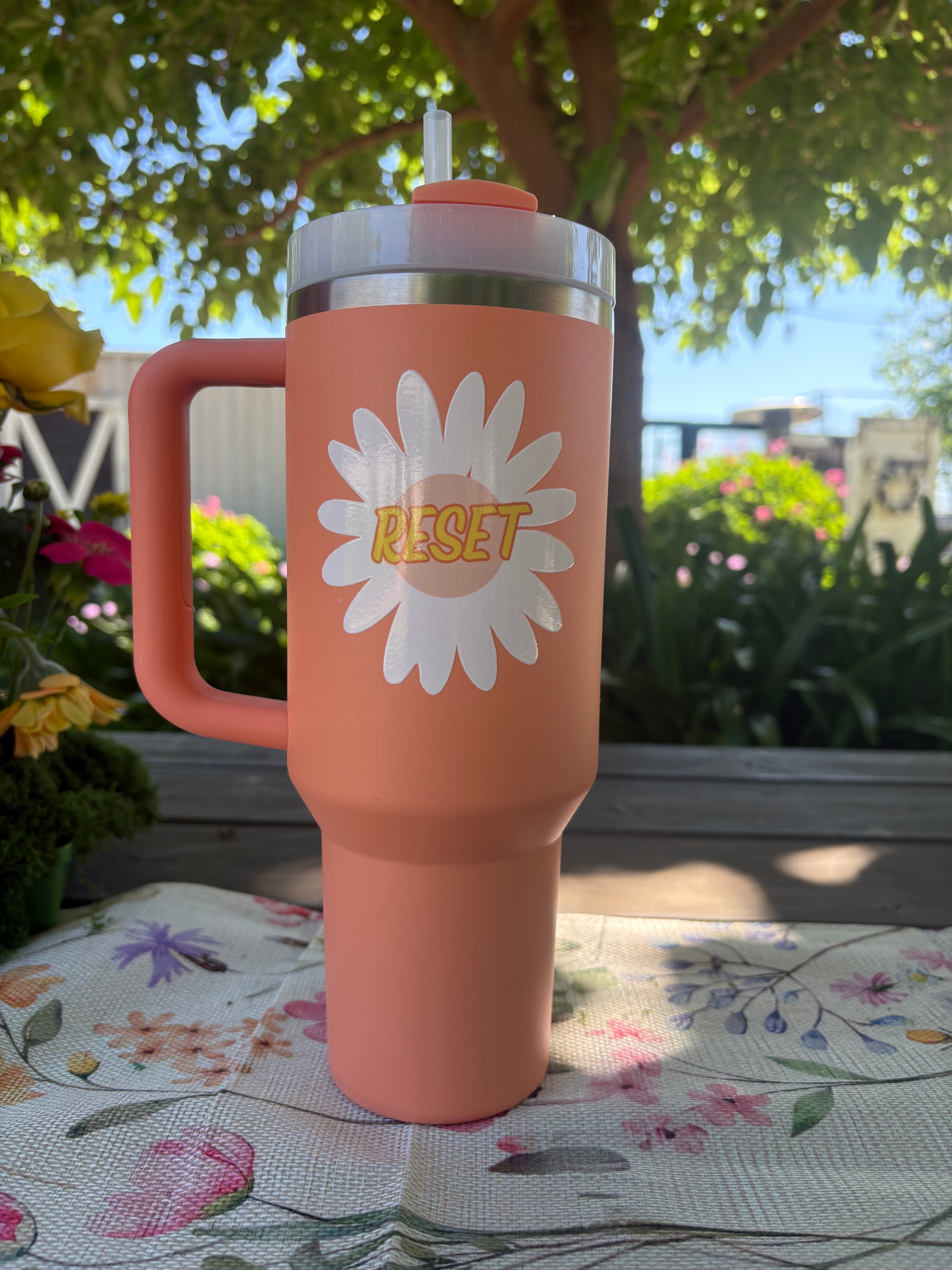 Peach Stanley - featuring the RESET Flower logo             40 oz Stainless Steel H2.0 FlowState Quencher Tumbler